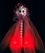 Miss Perfect, 8x20x3.5, fabric, wood, acrylic,  glass, papier mache, bricks, dynel and lightbulbs, 2003